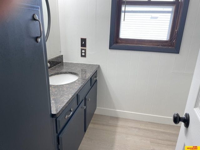 bathroom with vanity and wood-type flooring