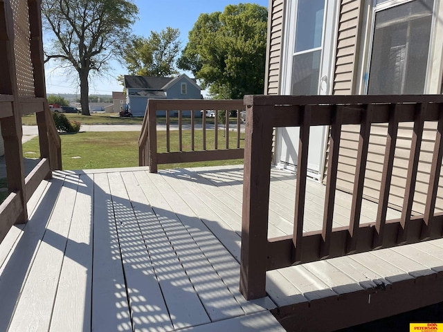 wooden terrace with a yard