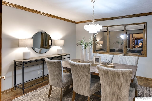 dining area with ornamental molding, an inviting chandelier, and dark parquet flooring