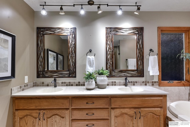 bathroom with vanity and a tub to relax in