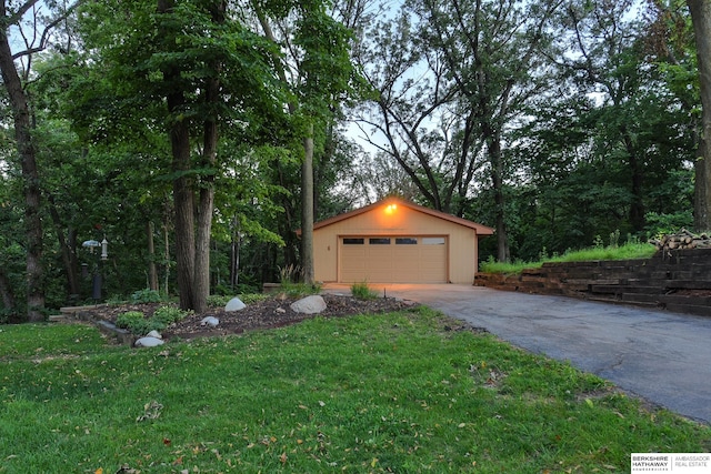 garage featuring a lawn