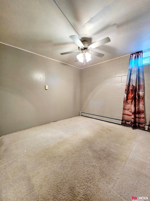 carpeted spare room featuring ceiling fan, a baseboard radiator, and a textured ceiling