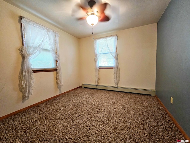 carpeted empty room with ceiling fan and a baseboard radiator