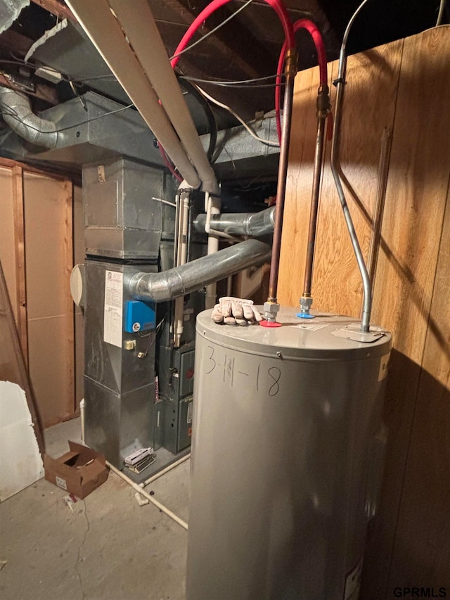 utility room featuring electric water heater