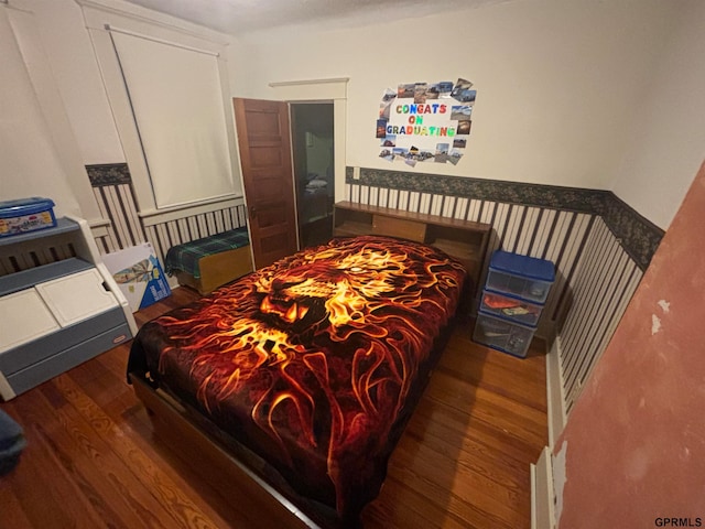 bedroom with hardwood / wood-style floors