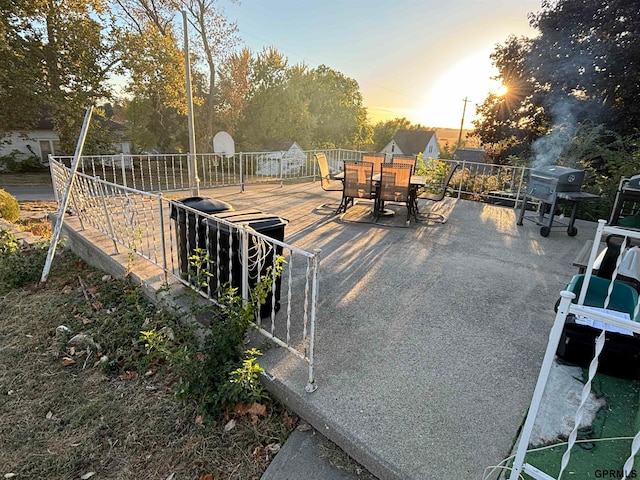 view of patio terrace at dusk