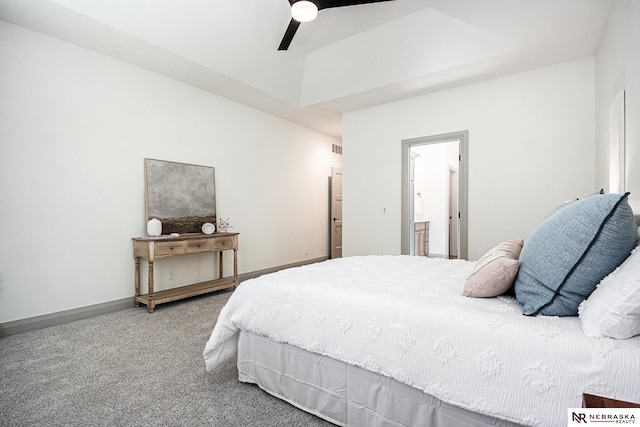 carpeted bedroom featuring ceiling fan and ensuite bath