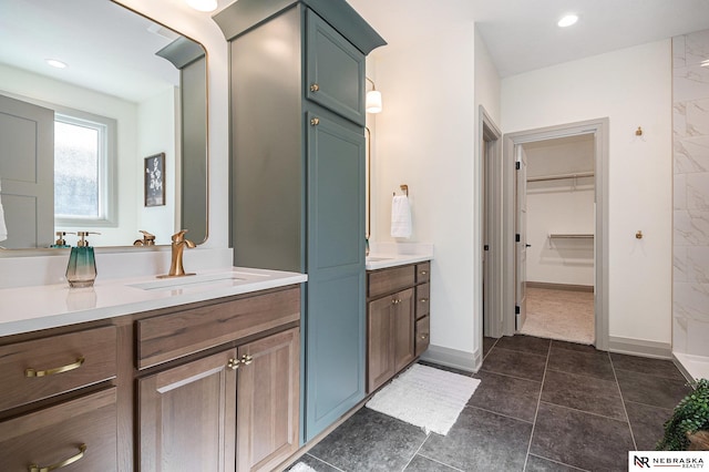 bathroom featuring tile patterned flooring and vanity