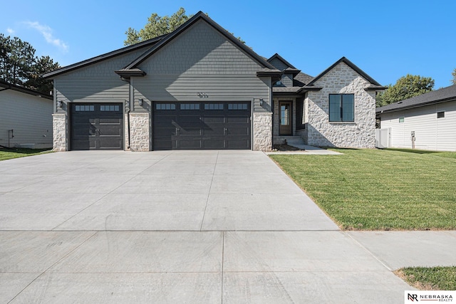 view of front of property featuring a garage and a front yard