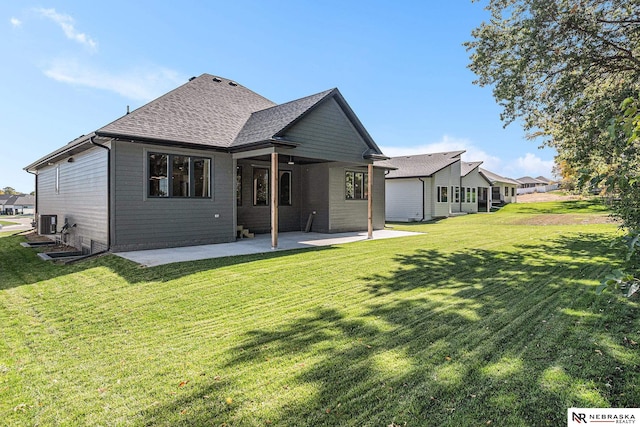 back of property featuring a lawn and a patio