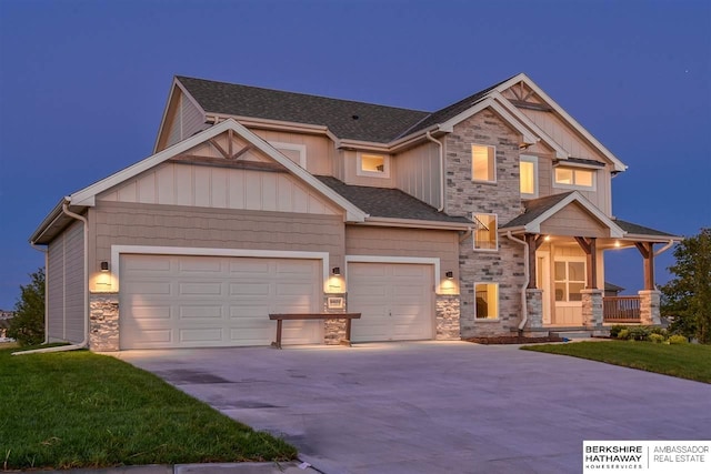 craftsman-style house with covered porch and a garage