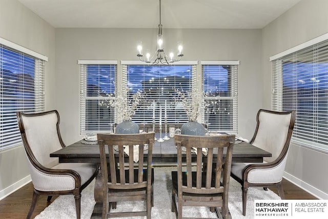 dining area with a chandelier and hardwood / wood-style floors