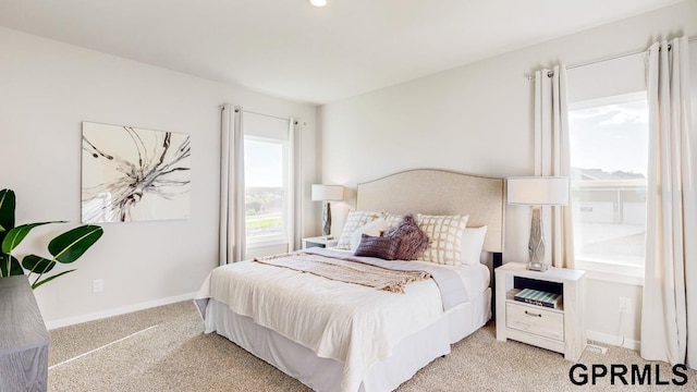 bedroom featuring light colored carpet