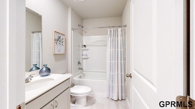 full bathroom with vanity, toilet, and shower / bathtub combination with curtain