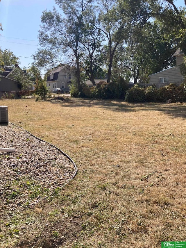 view of yard featuring central air condition unit