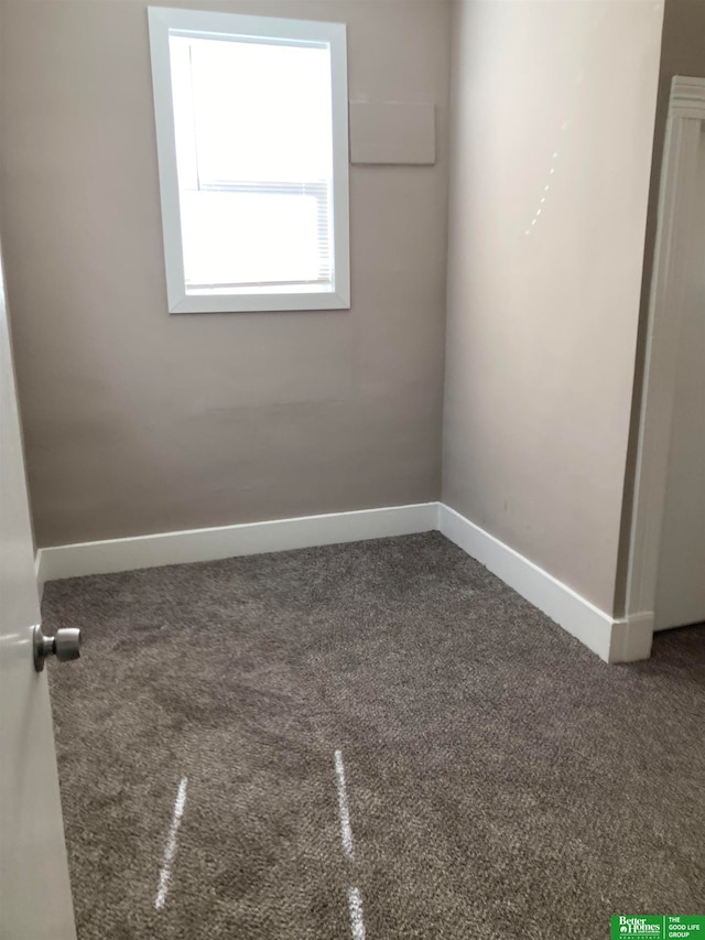 empty room with carpet flooring