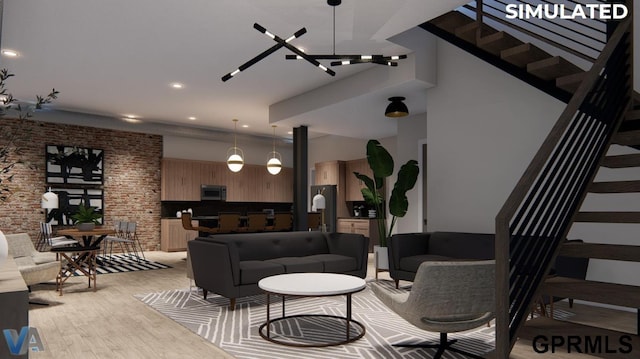 living room featuring light hardwood / wood-style floors and a high ceiling