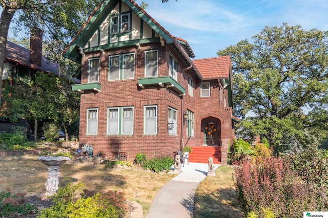 view of front of property featuring brick siding