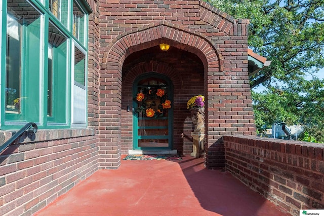 property entrance with brick siding