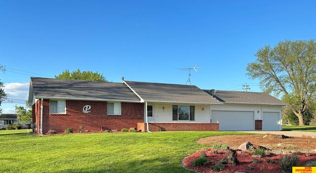 ranch-style home with a front yard and a garage