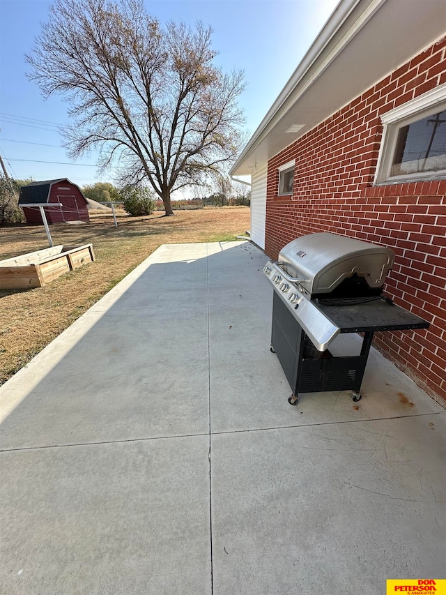 view of patio featuring a grill