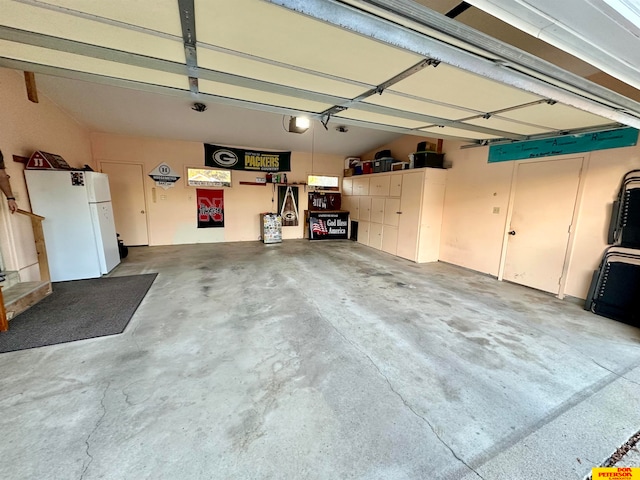 garage with white fridge