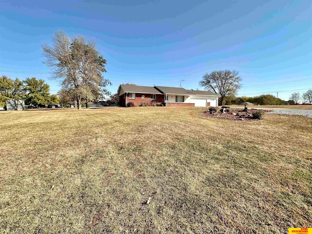 view of yard featuring a garage