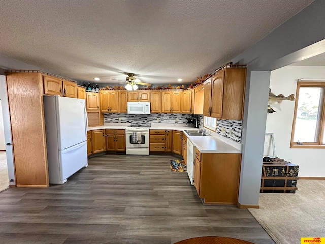 kitchen with decorative backsplash, ceiling fan, a textured ceiling, dark hardwood / wood-style floors, and white appliances