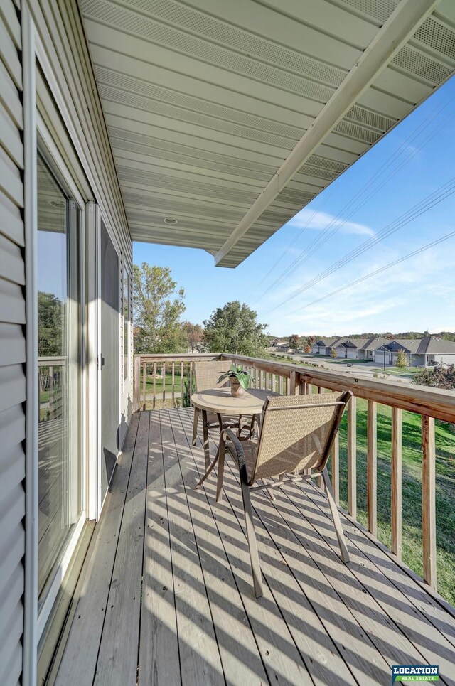 wooden deck with a yard