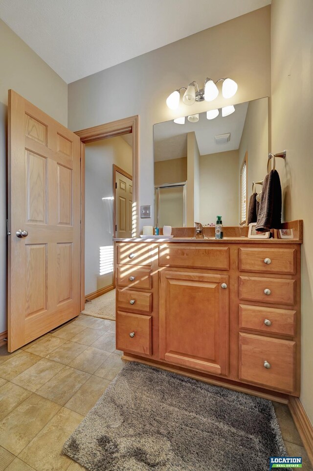 bathroom featuring vanity and walk in shower