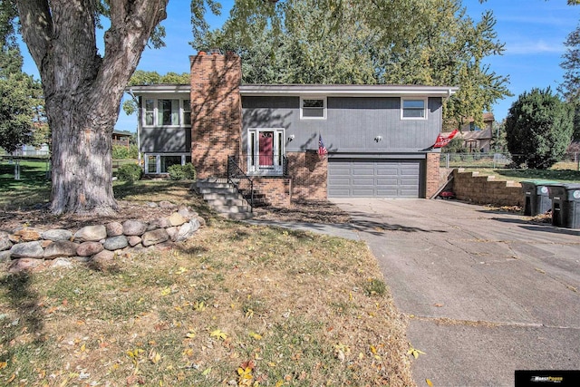 split foyer home featuring a garage