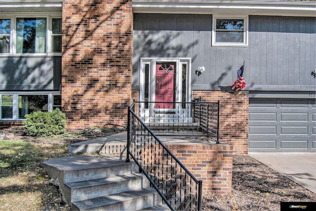 doorway to property featuring a garage