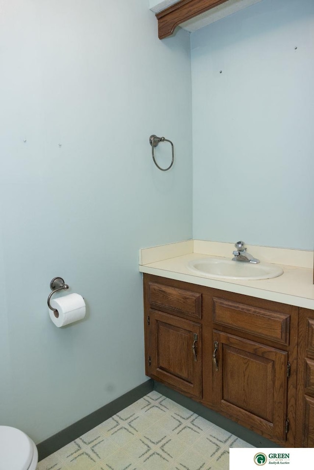 bathroom with vanity and toilet