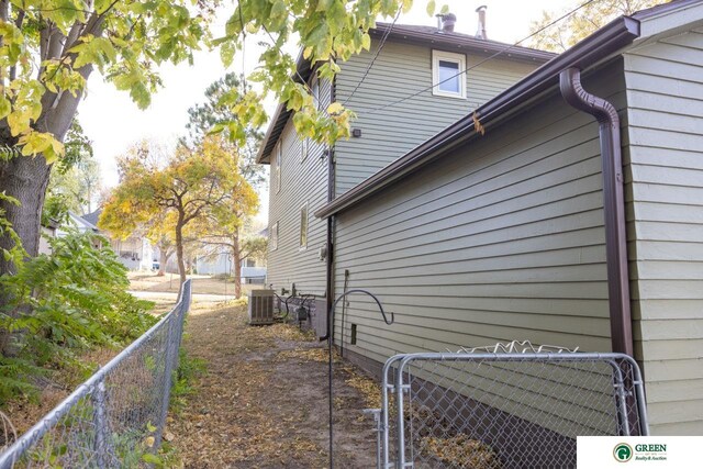 view of side of home featuring central air condition unit