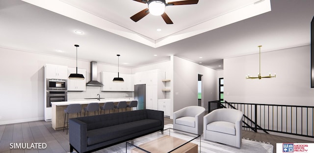 living room with sink, light hardwood / wood-style flooring, and ceiling fan with notable chandelier