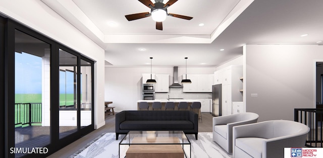 living room featuring sink, a raised ceiling, and ceiling fan