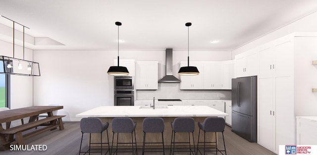 kitchen with a center island with sink, wall chimney range hood, stainless steel appliances, and wood-type flooring