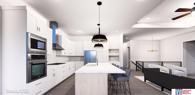 kitchen with decorative backsplash, dark hardwood / wood-style floors, an island with sink, stainless steel appliances, and white cabinets