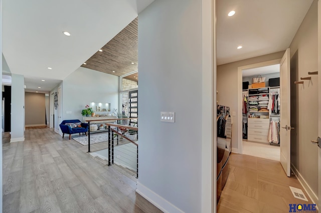 hall with light hardwood / wood-style flooring