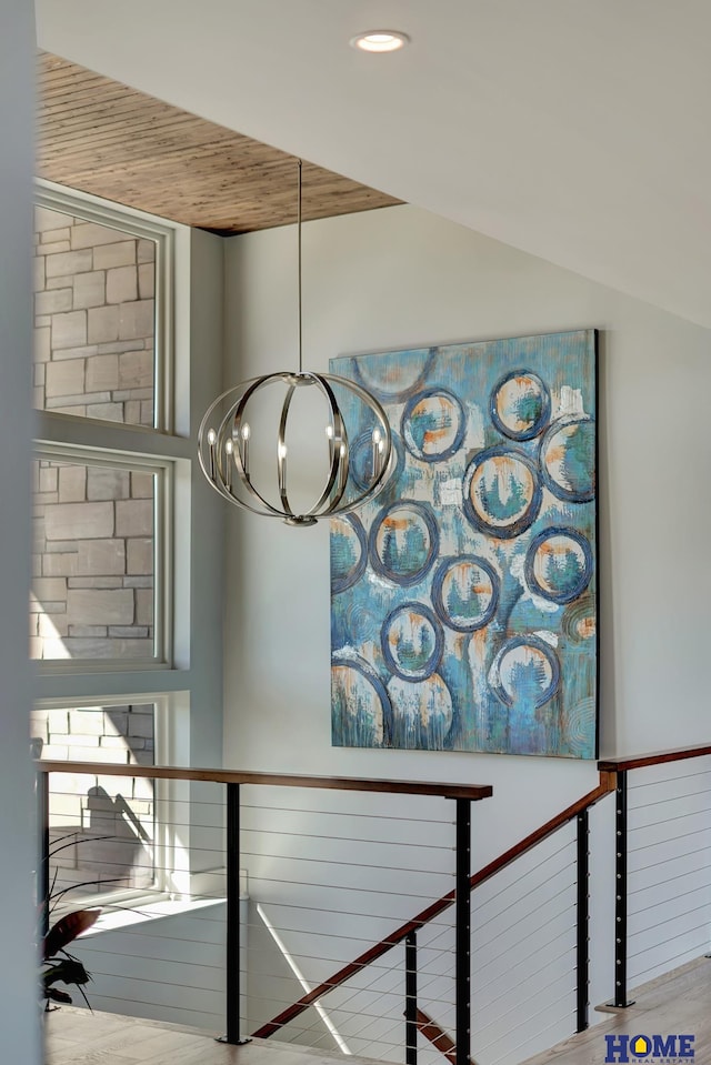 details featuring wooden ceiling and an inviting chandelier