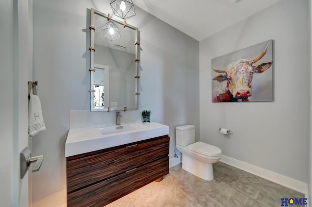 bathroom featuring vanity, toilet, and tile patterned floors