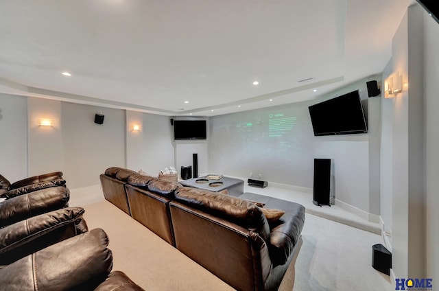 cinema room featuring light carpet