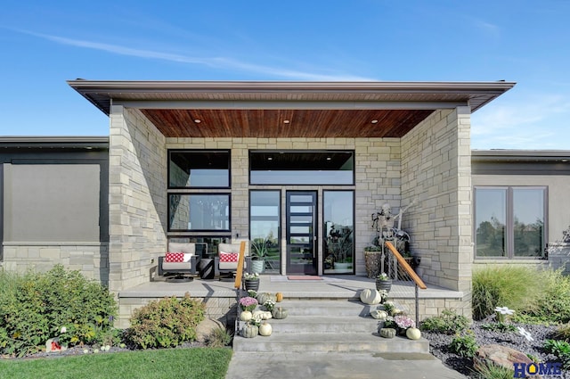 doorway to property with covered porch