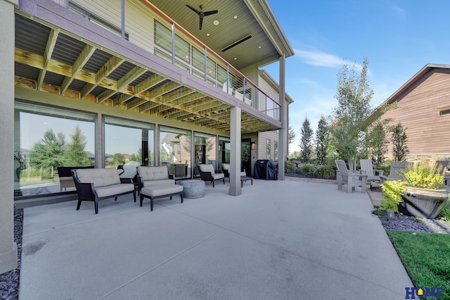 view of patio featuring an outdoor living space and a balcony