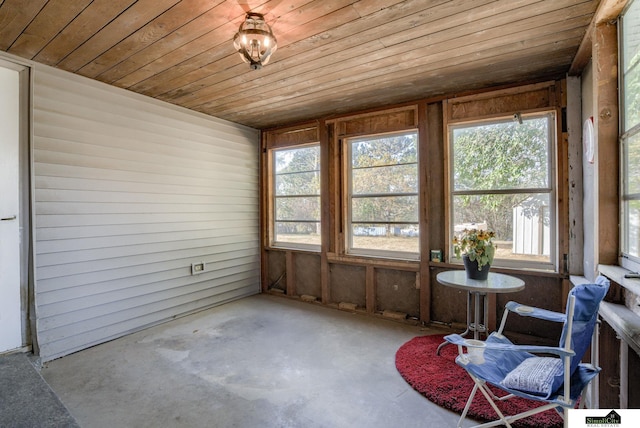 unfurnished sunroom featuring wood ceiling