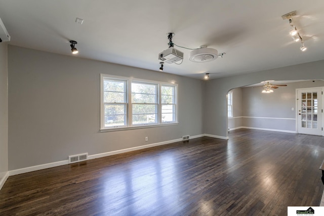 empty room with dark wood-type flooring, french doors, and ceiling fan