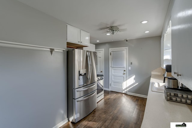 kitchen featuring stainless steel appliances, sink, dark hardwood / wood-style flooring, white cabinets, and ceiling fan