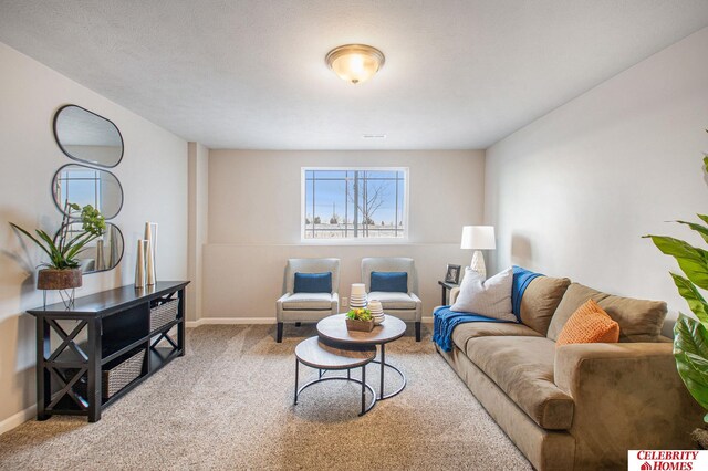 living room featuring a textured ceiling and light colored carpet