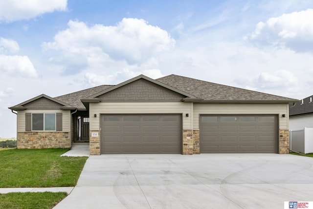 view of front of house featuring a front yard and a garage