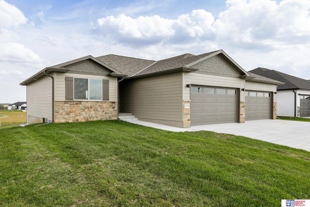 view of front of home with a garage and a front lawn